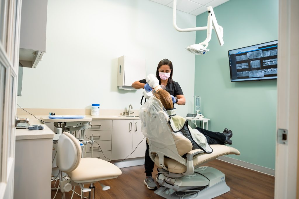 Dentist Providing Dental Services to Patient